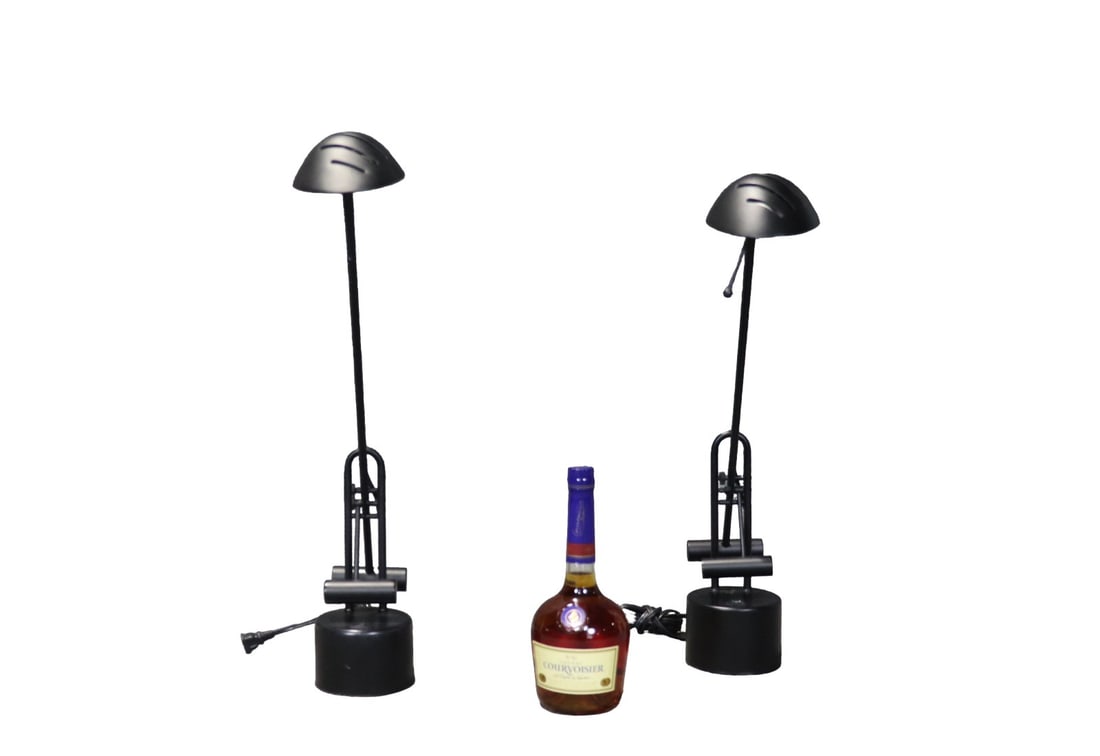 PAIR BLACK METAL DESIGN ADJUSTABLE TELESCOPIC ARM LAMPS: Black metal. Adjustable. Telescopic arms. 23 1/2" h x 4 1/2" w x 29" d.