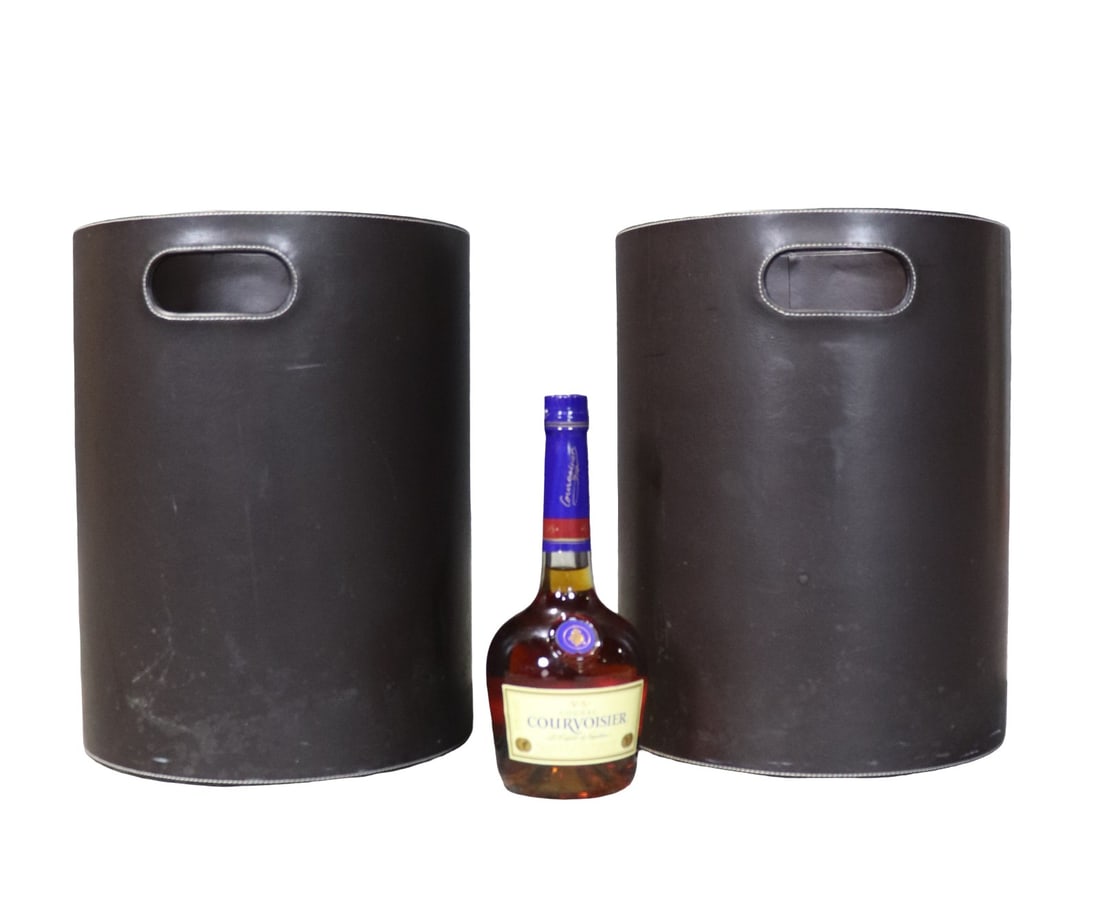 2 BROWN CYLINDRICAL WASTE BASKETS: Leather like material. 15 3/8" h x 11 3/4" diameter.