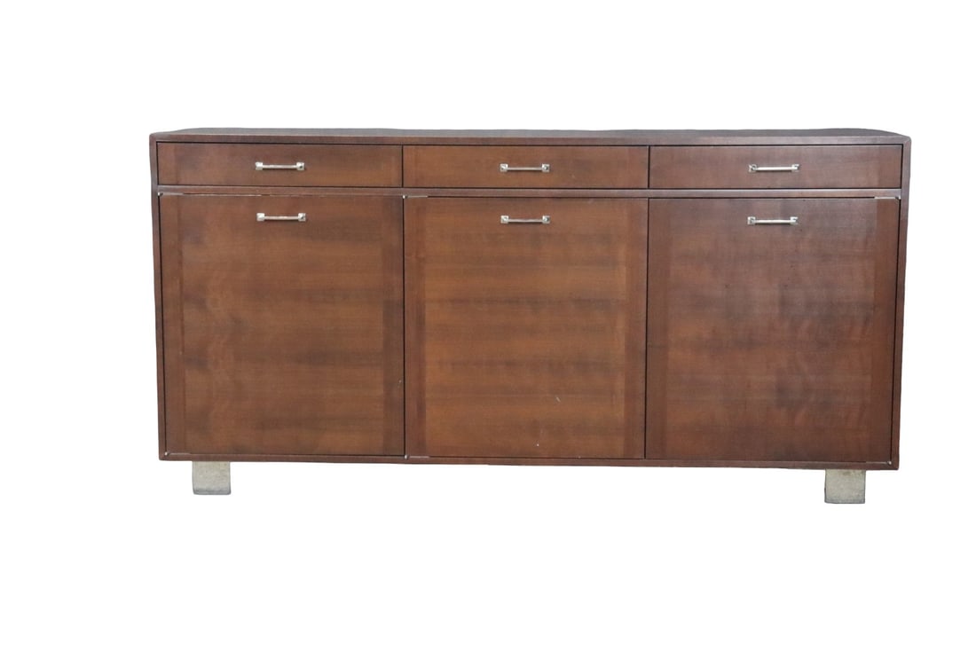 MID CENTURY MODERN WALNUT FINISH & CHROME CABINET: Walnut finish. Chrome legs and hardware. 3 drawers. 3 doors containing 2 pull out drawers each. 36 1/2" h x 72 1/8" w x 22 1/4" d.