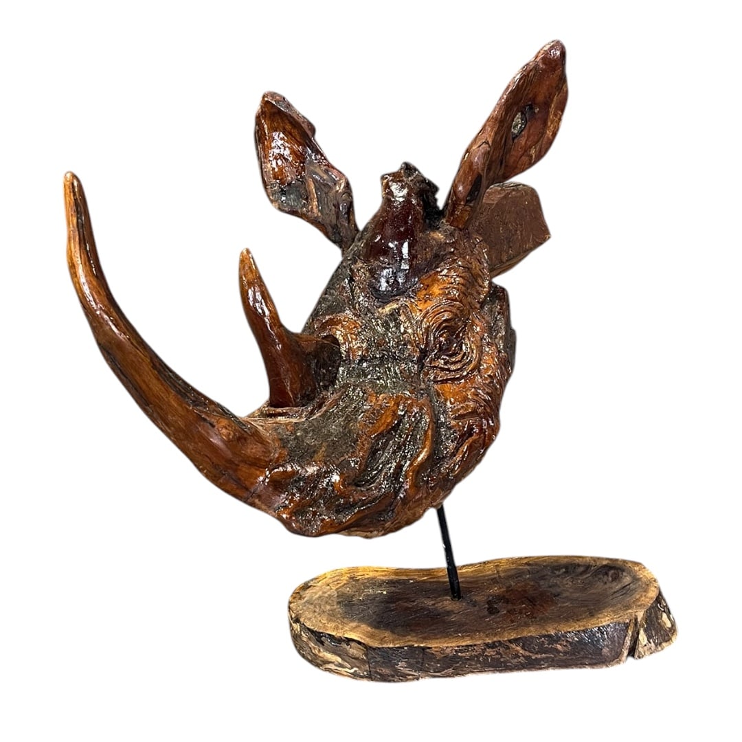 HAND CARVED WOODEN RHINO HEAD: Carved. Wood. 23" h x 15 1/2" w x 26 1/2" d.