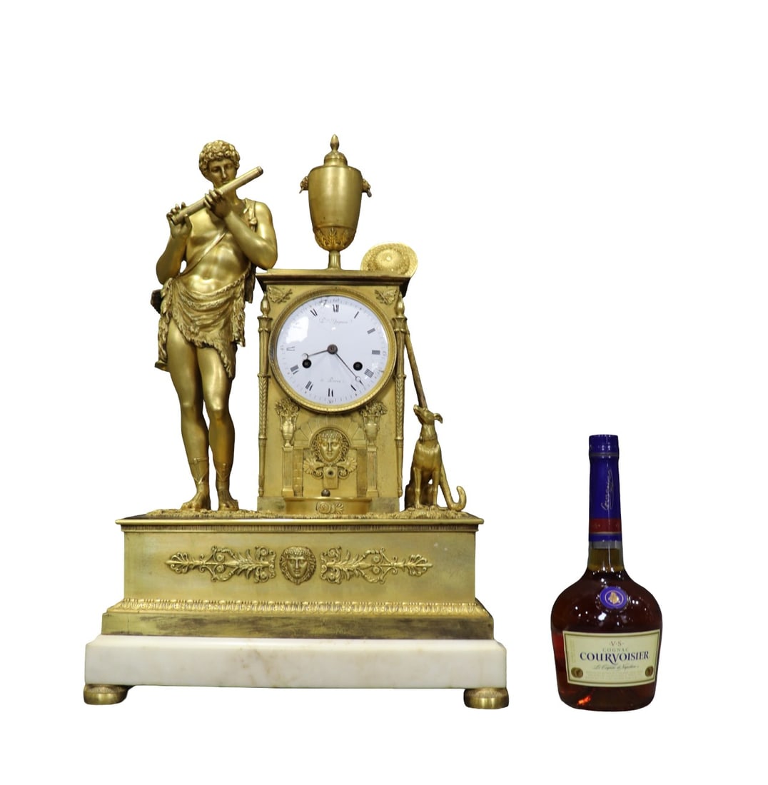BRONZE EMPIRE FRENCH CLOCK: Bronze. Figural. Marble base. 24 1/4" h x 16 1/4" w x 8 1/4" d.
