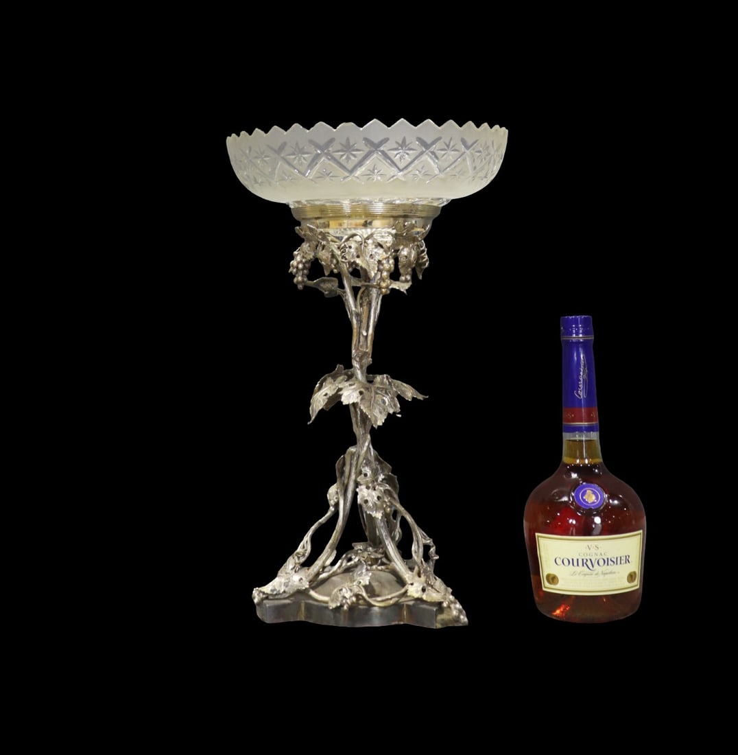 BRONZE WITH SILVER FINISH FIGURAL CENTERPIECE: Bronze with silver finish. Cut glass dish on top. 17 1/8" h x 10 3/8" diameter.