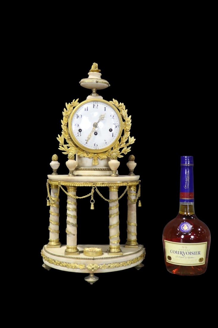 BRONZE & MARBLE COLUMN CLOCK: Bronze. Marble. With pendulum. 19 3/4" h x 9 5/8" w x 5 1/4" d.