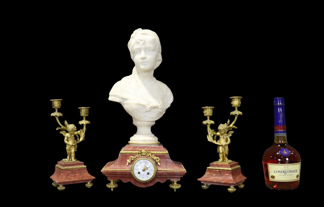 3 PIECE CLOCK SET WITH CANDLEABARA & BUST OF CHILD: Marble bust signed on back. 3 pieces. Candelabras measure 10 3/4" h x 4 3/4" w x 4 3/4" d. Clock/bust measures 19 1/4" h x 9 3/4" w x 6" d.