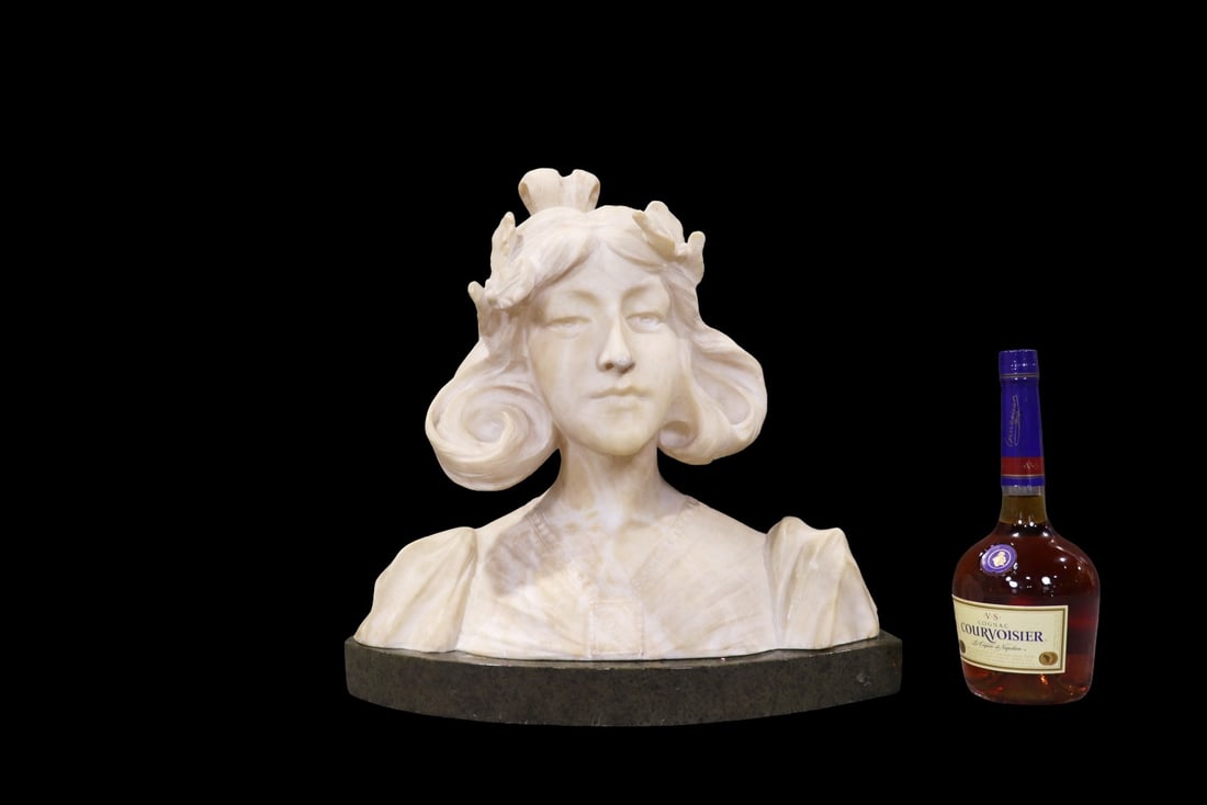 MARBLE BUST OF A WOMAN: Marble on base. Carved Beatrice on the front. 16 3/4" h x 18" w x 5 1/2" d.