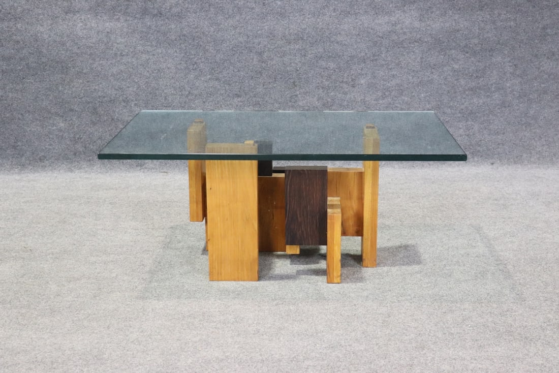 SIGNED JEFFREY GREENE GLASS TOP COFFEE TABLE: Wood base. Glass top. Beveled edge. 17 3/8" h x 40" w x 24 1/8" d.