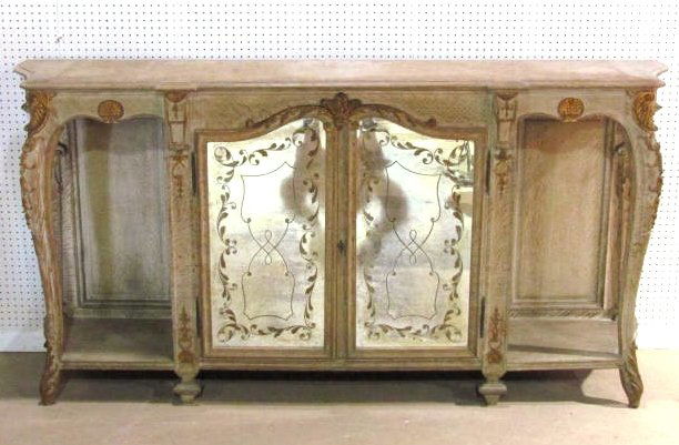 JANSEN FRENCH CARVED OAK CREDENZA: Mirrored doors. Very good condition. 43 1/4"h. x 85 1/2"w. x 18"d.