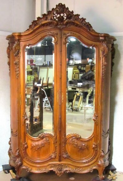 ANTIQUE FRENCH CARVED MIRROR DOOR ARMOIRE: Very good quality with fine carving. Beveled mirror door. Very good condition with a seam split on the side panel. Some areas of silvering loss on mirror. 109"h. x 83 1/4"w. x 25 1/2"d.