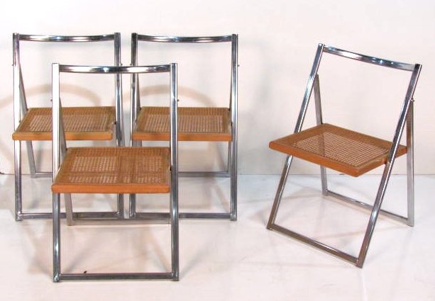 4 ITALIAN CHROME CANED SEAT FOLDING CHAIRS: Chrome frames with caned hardwood seats. All four fold up with ease. Very good condition. 33"h. x 19 1/2"w. x 17"d.