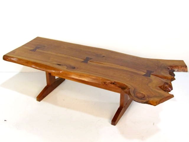 WALNUT SLAB COFFEE TABLE in the manner of NAKASHIMA: Very good condition. 16 1/2"h. x 58 1/2"w. x 30"d.
