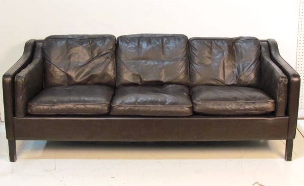 DANISH 3 PLACE LEATHER SOFA: Wear to leather. Tear in center cushion. Good condition. 28"h. x 76 1/2"w. x 32"d.