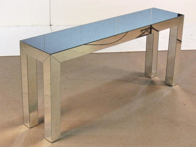 MIRRORED CONSOLE TABLE: Very good condition. 29"h. x 65"w. x 15"d.