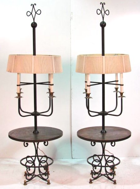 Pair TOMMI PARZINGER FLOOR LAMPS: Black painted metal and brass frames with distressed wooden tops. Removed from a Sutton Place, New York Apartment. Good condition, unsigned. 79"h. x 24"diam.