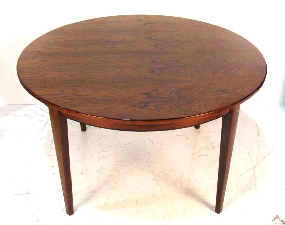 N.O. MOLLER ROSEWOOD DINING TABLE w/ 2 BOARDS: Very good condition. 28"h. x 47 1/2"diam. Two 19 3/4"w. boards.
