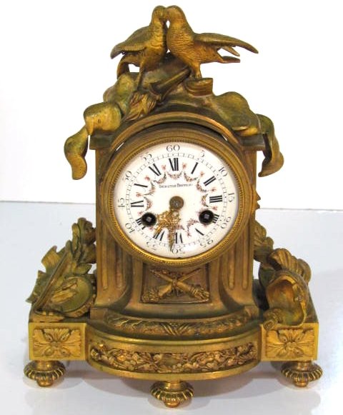FRENCH BRONZE SHELF CLOCK w/ LOVE BIRDS: Vincent and Cie movement. Missing front crystal. Good condition. 9 1/2"h. x 8"w.