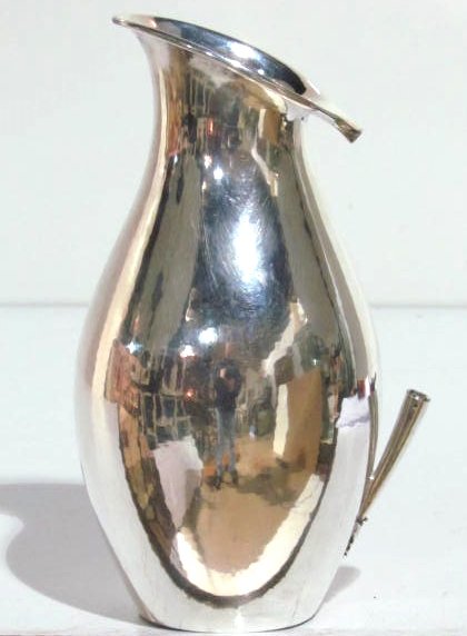 GEORG JENSEN JOHAN ROHDE STERLING SILVER PITCHER: #432E. Missing ebony handle. Silver in very good condition with no dents or damages. 9" high.