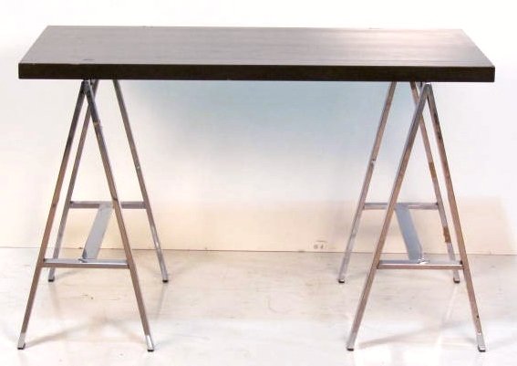 BRUETON CHROME & LAMINATE SAWHORSE TABLE: Laminate top with wear and damages. Fair condition. 30"h. x 47 1/4"w. x 25 3/4"d.