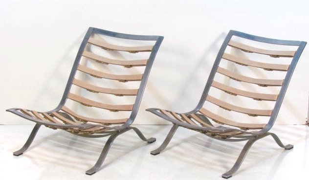 Pair ARNE NORELL ARI SWEDISH STEEL LOUNGE CHAIRS: Steel and leather straps. Very good condition. 29 1/2"h. x 25 1/2"w. x 37"d.