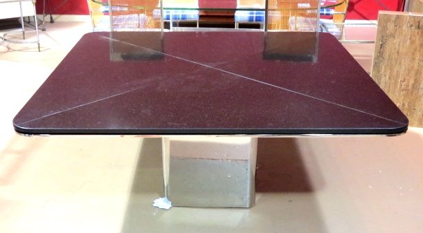BRUETON GRANITE & CHROME DINING TABLE: Chrome metal base. Four section black granite top. Very good condition. 29 1/2"h. x 66" square.