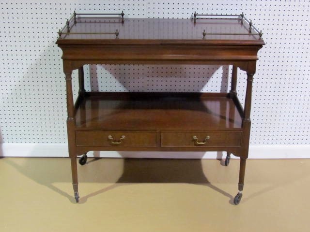 KITTINGER 2 DRAWER BAR CART: Wear to finish. Bronze gallery. 34 1/2"h. x 36"w. x 18 1/4"d.