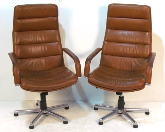 Pair ARTIFORT LEATHER SWIVEL DESK CHAIRS: Good condition. Worn leather on arms. 48"h. x 26 1/2"w. x 26"d.