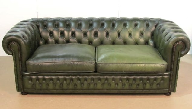 GREEN ENGLISH TUFTED LEATHER CHESTERFIELD SOFA: Distressed leather with light wear. Winchester Furniture, England. Very good condition. 29"h. x 80"w. x 36"d.