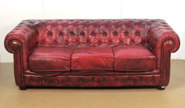 ENGLISH RED TUFTED LEATHER CHESTERFIELD SOFA: Distressed leather with wear. Very good condition. 31"h. x 84"w. x 38"d.