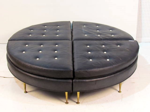 MID CENTURY DUNBAR 65" ROUND 4 SECTION BLACK BENCH: Black vinyl. Missing 3 buttons. Wear to brass legs. Good condition. 17 1/2"h. x 65"diam.