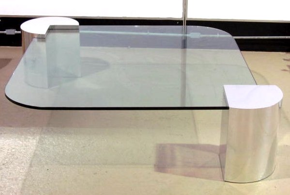 KARL SPRINGER STYLE CHROME & GLASS COCKTAIL TABLE: Good condition. 1" chip on edge of glass. Scratches and scuffs on chrome. 18 1/4"h. x 68" square. Glass 60" square.