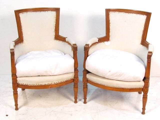 Pair ANTIQUE DIRECTOIRE STYLE BERGERES: Pegged frames. Need reupholstering. Missing rosettes on arms. Fair condition. 35"h. x 25"w. x 24"d.