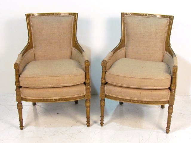 Pair LOUIS XVI STYLE WALNUT & GILT BERGERES: Burlap upholstery. Very good condition. 38"h. x 27"w. x 35"d.
