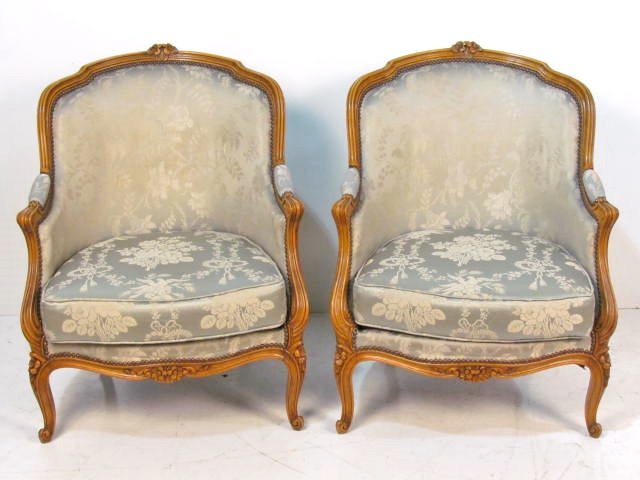 Pair FRENCH CARVED WALNUT BERGERES: Hole in one cushion. Good condition. 34"h. x 27"w. x 27"d.
