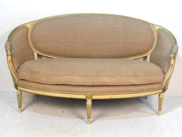 JANSEN DISTRESS PAINTED & GILT BURLAP CANAPE: Cream painted and gilt. Burlap upholstery. 39 1/2"h. x 74 1/4"w. x 33"d.