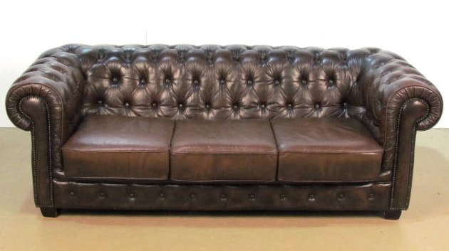 BROWN TUFTED LEATHER CHESTERFIELD SOFA: Distressed leather with light wear. Very good condition. 30"h. x 84"w. x 36"d.