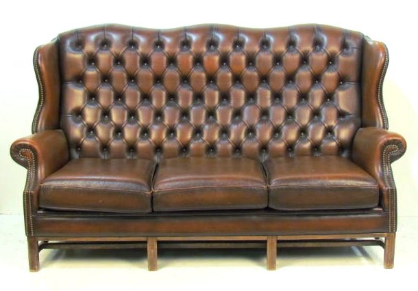 TUFTED LEATHER WINGBACK SOFA: Wear and scratches to leather. Good condition. 42"h. x 74"w. x 37"d.