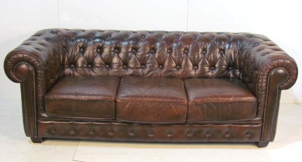 TUFTED BROWN LEATHER CHESTERFIELD SOFA: Distressed leather with light wear. Very good condition. 30 1/2"h. x 83"w. x 35"d.