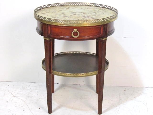 ANTIQUE MARBLETOP BOUILLOTTE TABLE: Bronze gallery with indentations. 28 3/4"h. x 23 1/4"diam.