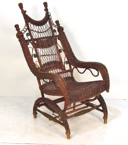 HEYWOOD WAKEFIELD STYLE WICKER PLATFORM ROCKER: Damage to wicker. Wear to finish. 46 1/2"h. x 25"w. x 34"d.