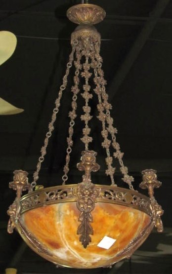 FRENCH EMPIRE STYLE BRONZE & ALABASTER CHANDELIER: Missing bottom finial. Lion's heads. Good condition.Rewiring recommended or may be required on all lighting.33"h. x 18"diam.