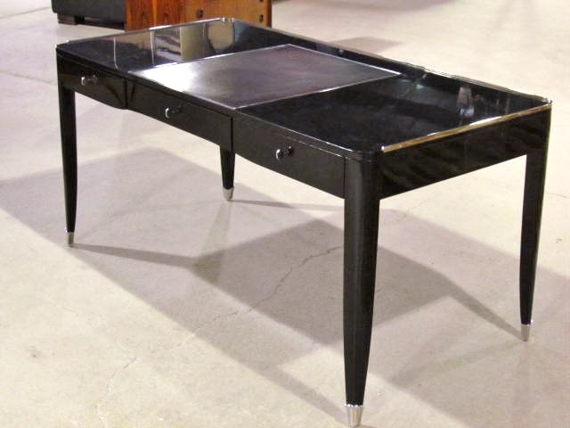 RALPH LAUREN EBONIZED LEATHERTOP BUREAUPLAT: Very good condition. 30 1/2"h. x 62 3/4"w. x 31 1/2"d.