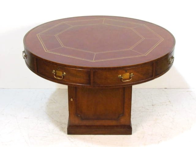 KITTINGER ROUND LEATHERTOP RENT TABLE: Scratches on leather. Minor veneer damage. Good condition. 31"h. x 48 1/4"w.