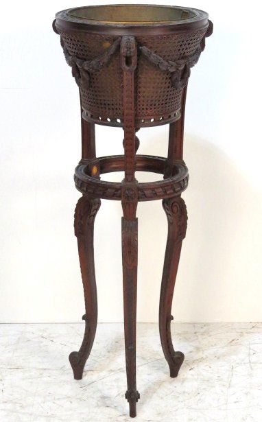 FRENCH CARVED WALNUT CANED FERNERY: Finely carved. Some small damages. Missing 2 rosettes. Fair condition. 43 1/4"h. x 18"diam.