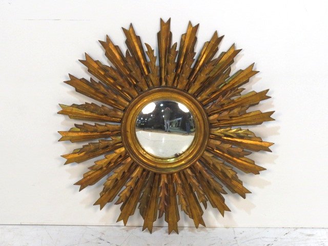 VINTAGE ITALIAN GILT WOOD SUNBURST MIRROR: Distressed gilt with wear. Very good condition. 32"diam.