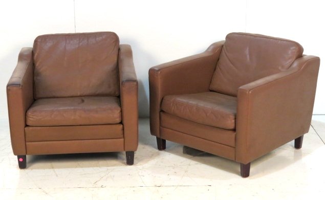 Pair SCANDINAVIAN MODERN LEATHER CLUB CHAIRS: Distressed leather with wear. Good condition. 27"h. x 30"w. x 32"d.
