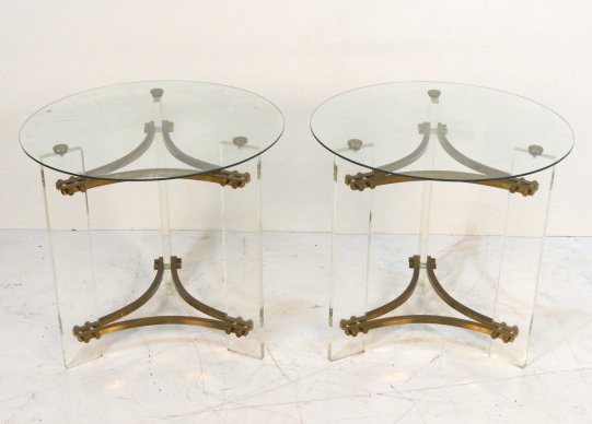 Pair CHARLES HOLLIS JONES BRASS & LUCITE END TABLES: Scratched glass tops. Pitting to brass finish. 1 chipped top. Good condition. 23 1/2"h. x 24 1/2"w.