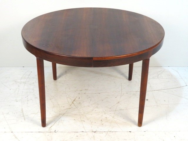 N.O. MOLLER DANISH MODERN ROSEWOOD DINING TABLE: Very good condition. 29"h. x 47"diam. One 19 1/2"w. board.
