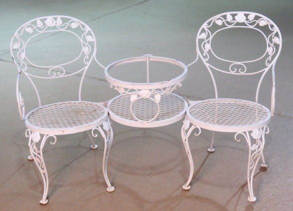 ITALIAN WROUGHT IRON PATIO SETTEE: Missing glass. Good condition. 34 1/2"h. x 55"w. x 20 1/2"d.