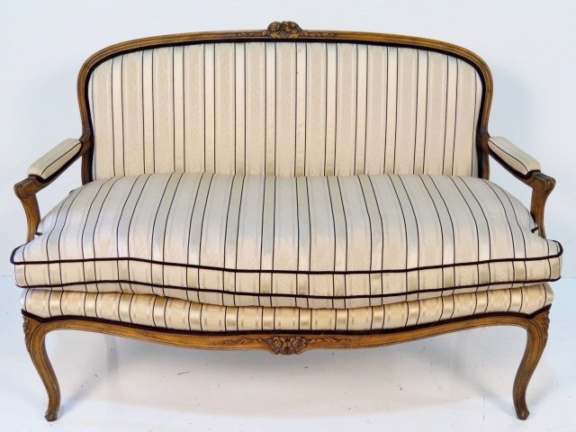 LOUIS XV STYLE CARVED SETTEE: Light soiling to upholstery. Very good condition. 37 1/2"h. x 54"w. x 28"d.