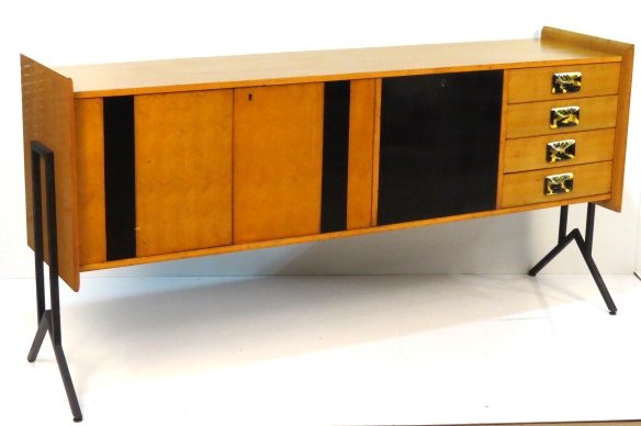 ITALIAN MODERN BIRCH & EBONIZED SIDEBOARD: Worn finish. Iron legs. Enameled metal pulls. Fair condition. 36"h. x 73"w. x 18"d.