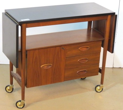 DANISH MODERN STYLE WALNUT DROPLEAF BAR CART: Black laminate top. Very good condition. 30 1/2"h. x 36"w. x 14 1/4"d.